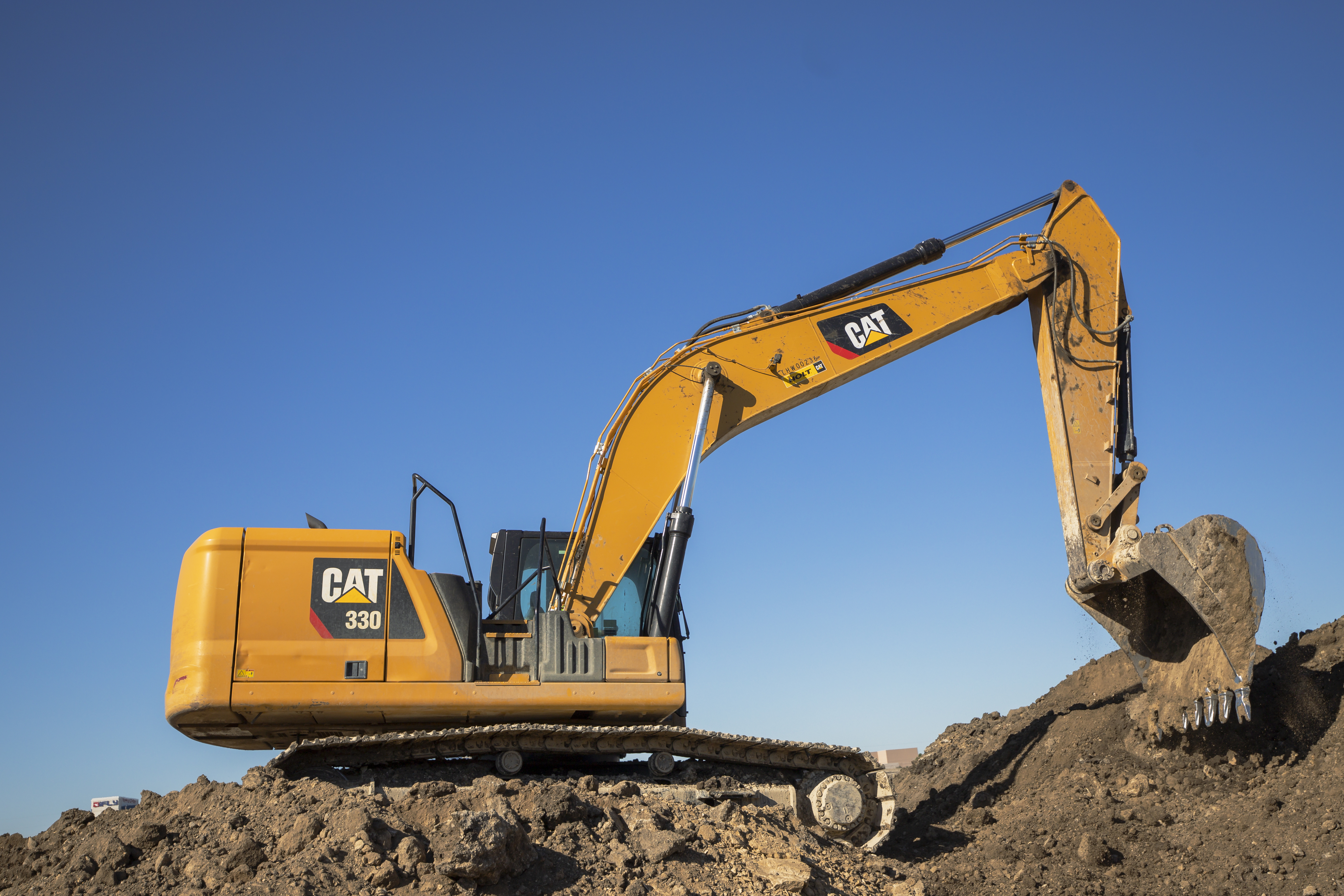 CAT excavator performing earthmoving and bulk excavation on an infrastructure site