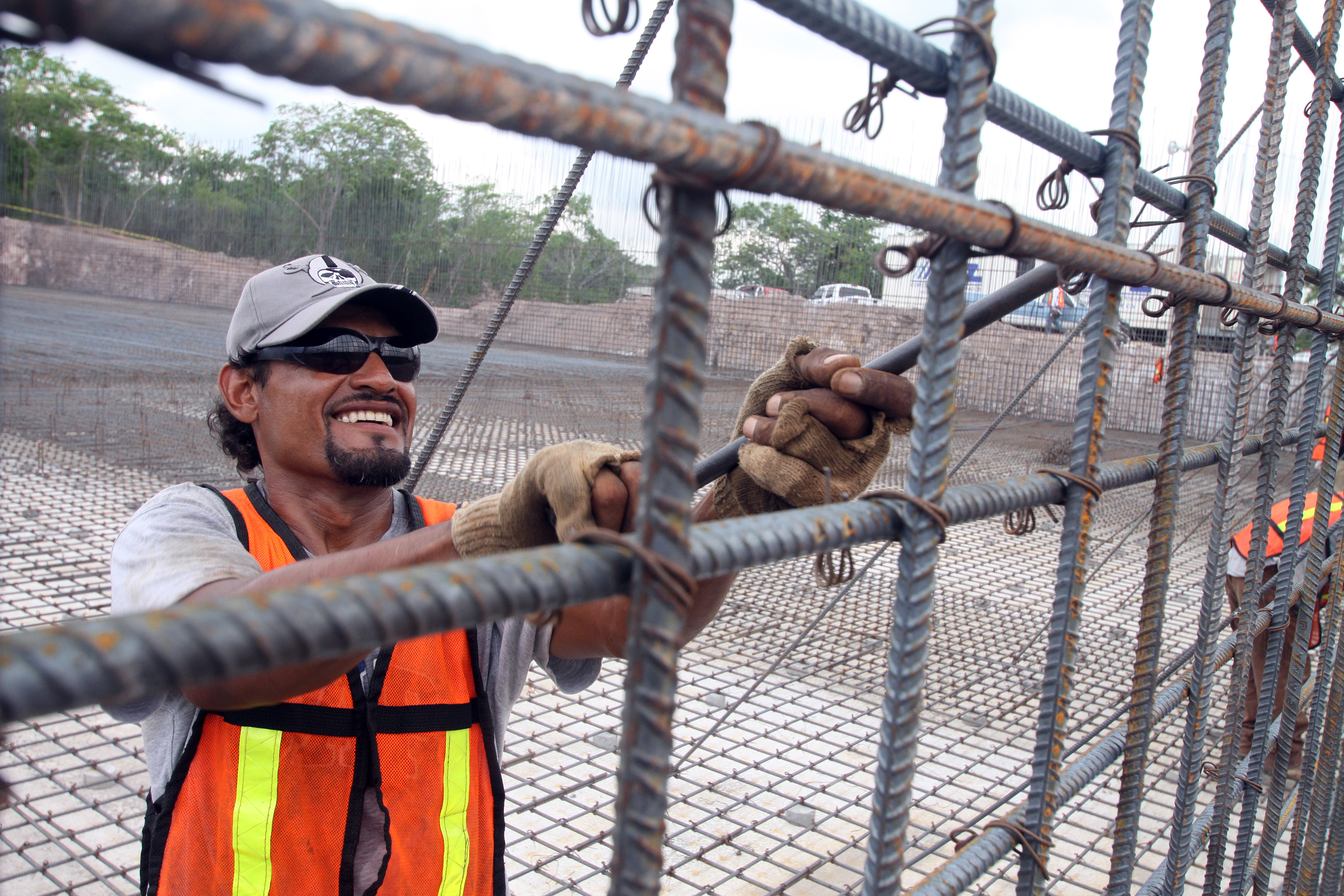 Rebar worker tying reinforcement steel for a concrete structure